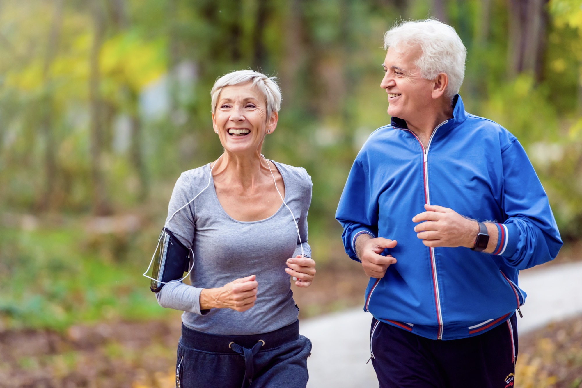 Smiling,Senior,Couple,Jogging,In,The,Park
