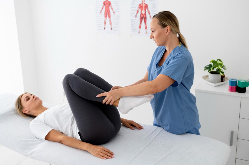 physiotherapist-helping-young-female-patient-her-clinic